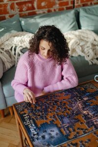 Woman Relaxing and do Jigsaw Puzzles