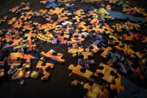 brown jigsaw pieces on a black table