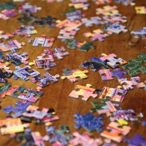 Jigsaw Puzzle pieces on a wooden table